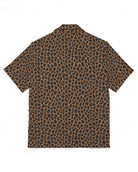 Black shirt with gold and purple pattern on a white background