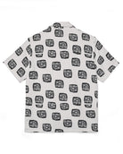 White shirt with black geometric pattern on a white background
