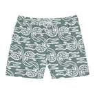 Green swim shorts with white crocodile pattern on a white background