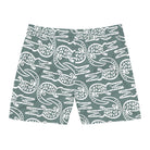 Teal shorts with white crocodile pattern on a white background