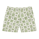 Green and white checkered shorts with tree pattern on a white background