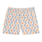 Swim shorts with starfish and wavy line pattern on a white background